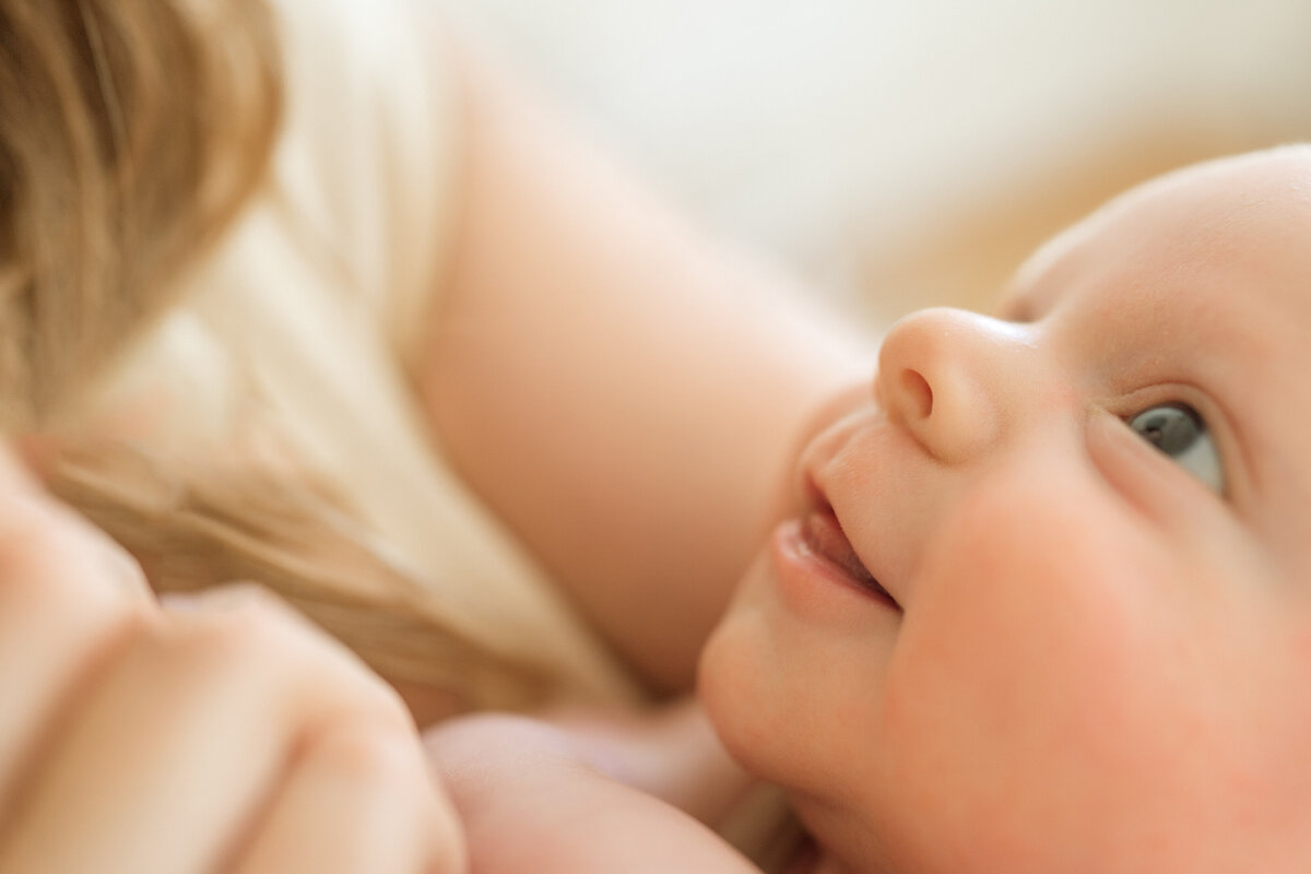 baby looking at mom 
