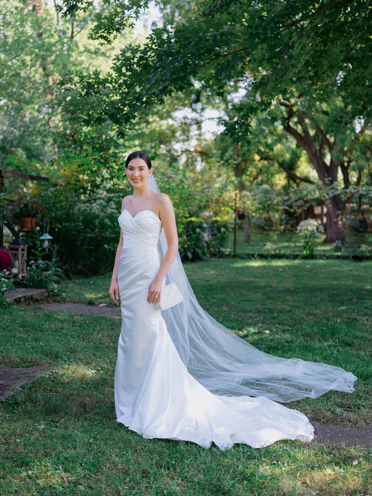 Bride in elegant Maggie Sottero gown at her backyard wedding