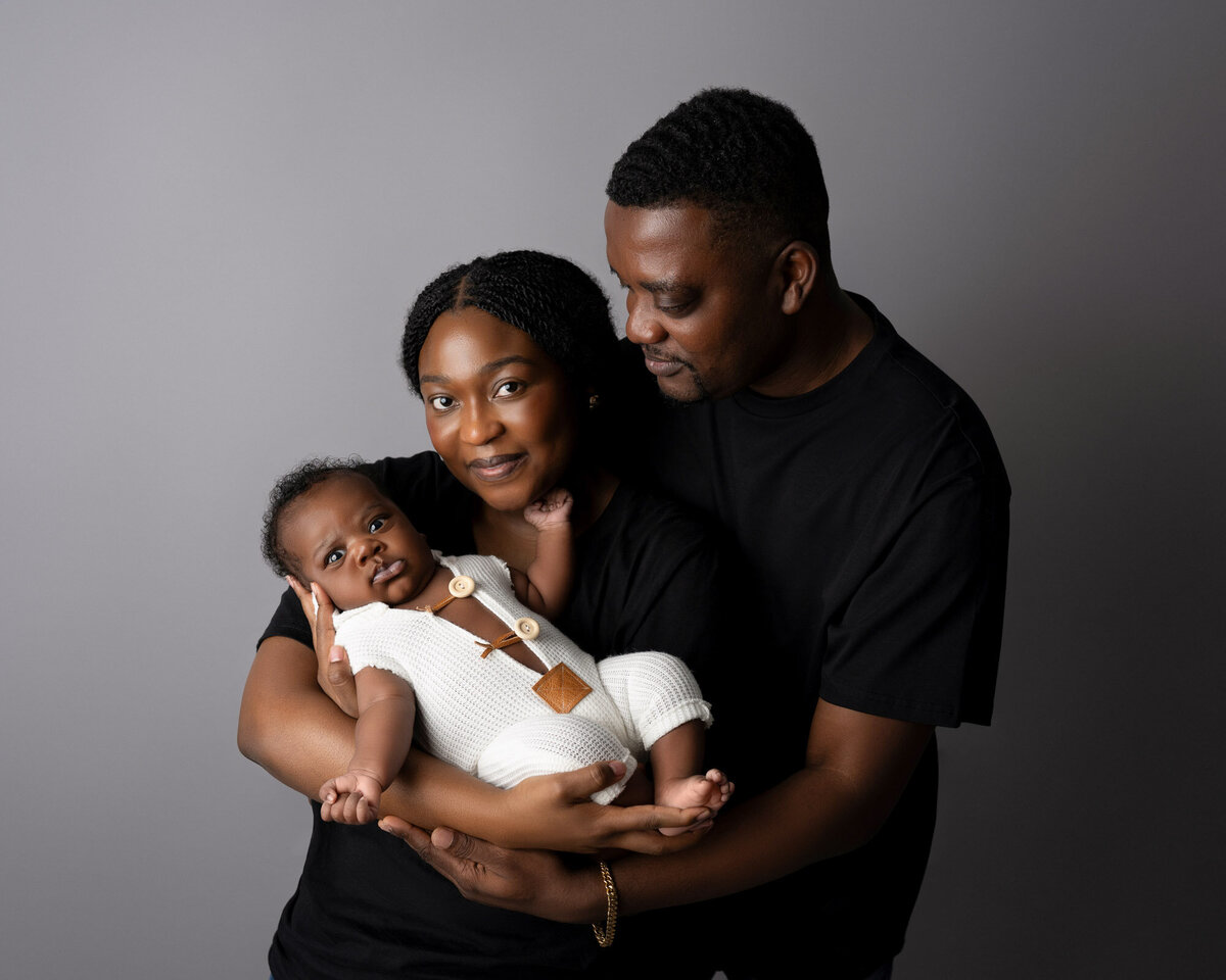 New parents with newborn baby family portrait Georgetown lifestyle photographer