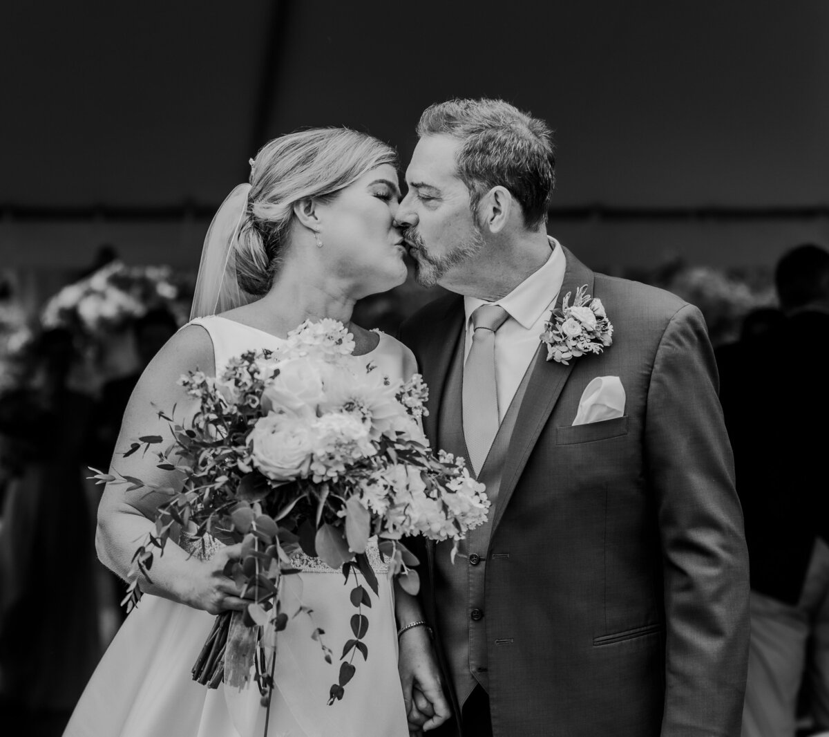 bride and groom kissing after walking down the aisle in Atlanta Georgia by wedding photographer Amanda Richardson Photography