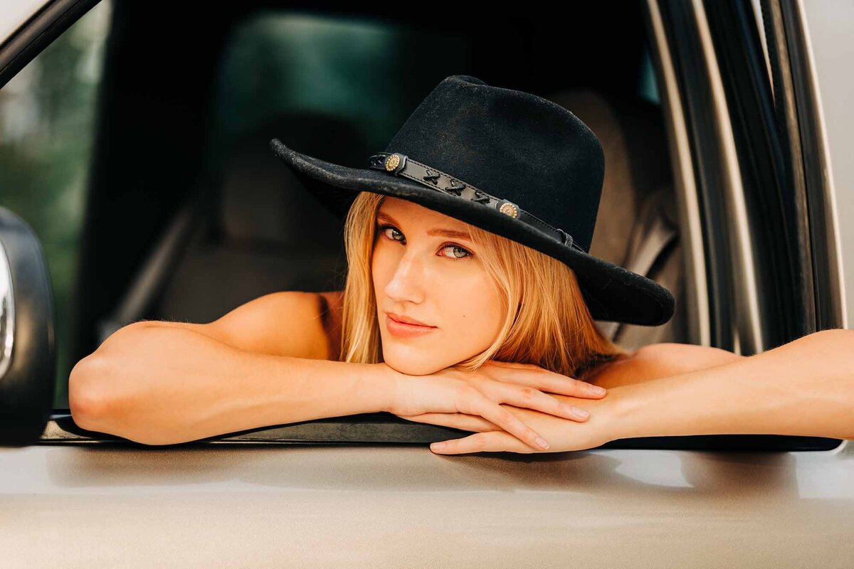 Montana model black cowgirl hat sitting in truck