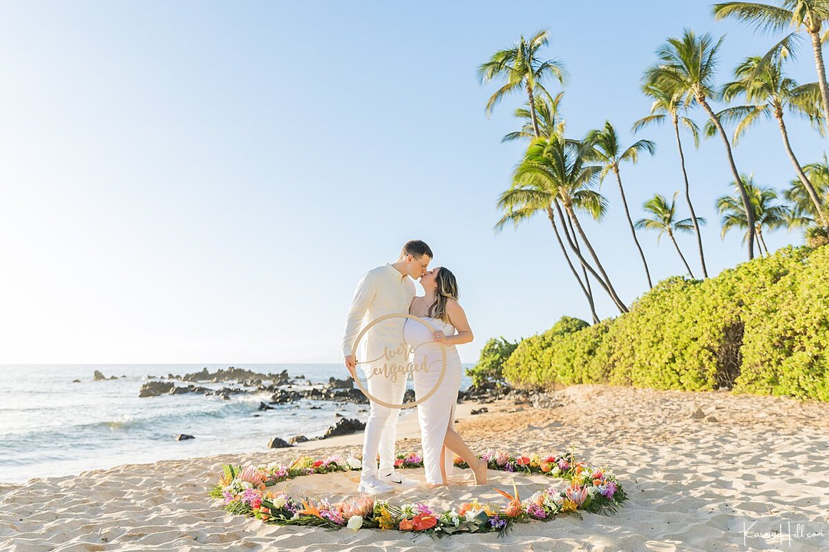 Romantic Beach proposal on a Sandy beach with flower circle