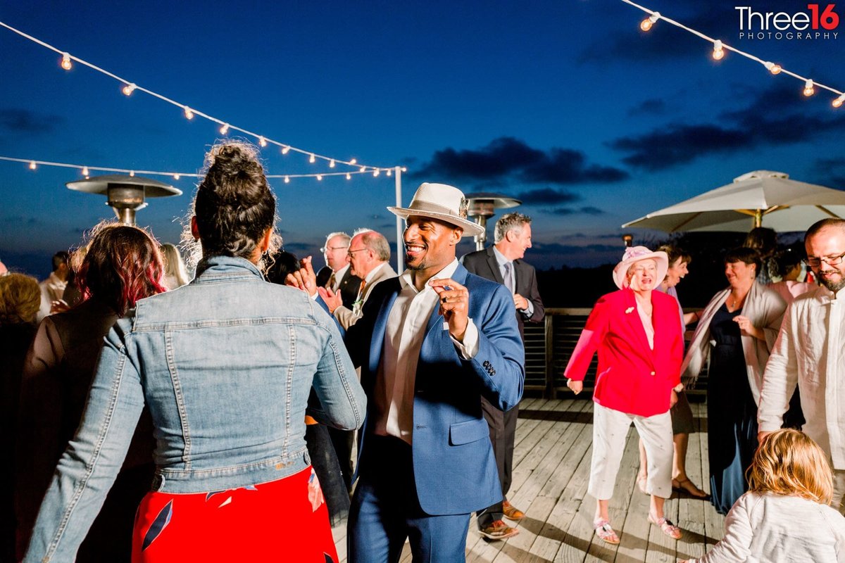 Guests dance the night away at a coastal wedding reception