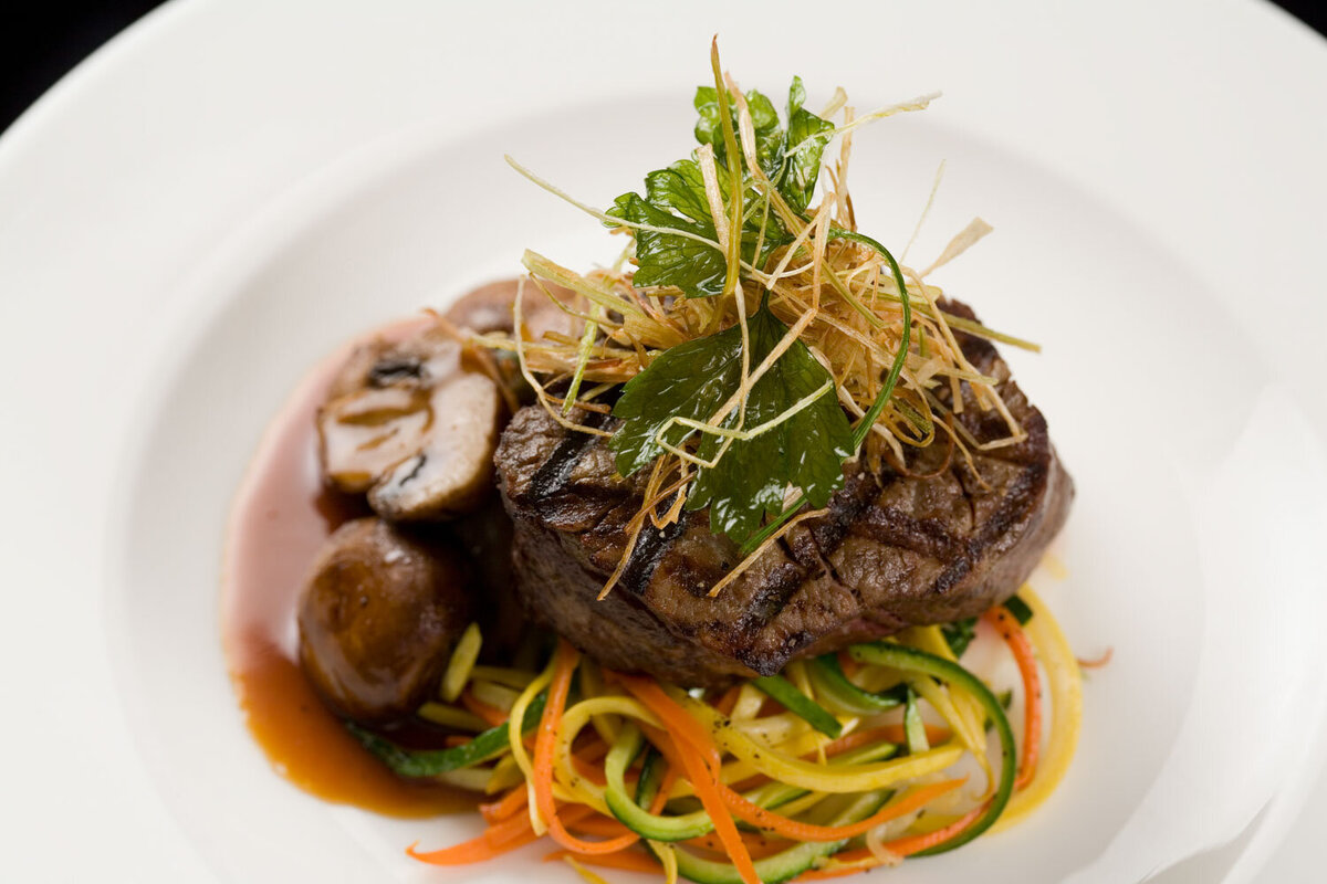 Surf and turf with shrimp, steak, and vegetables
