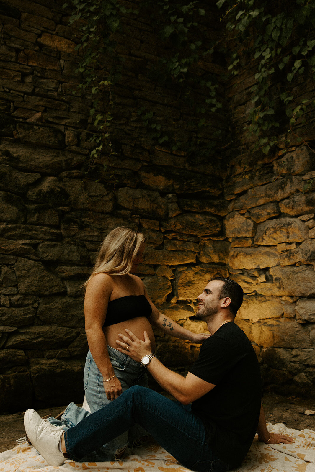 couple posing in the ruins at The Mill At Fine Creek during maternity photoshoot with Powhatan maternity photographer