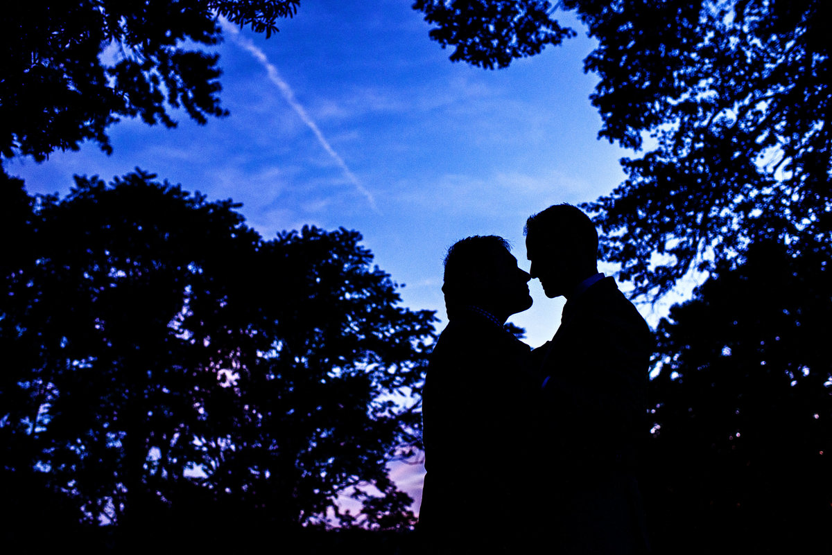 A same sex couple have a moment at sunset during their Patapsco Female Institute Wedding.