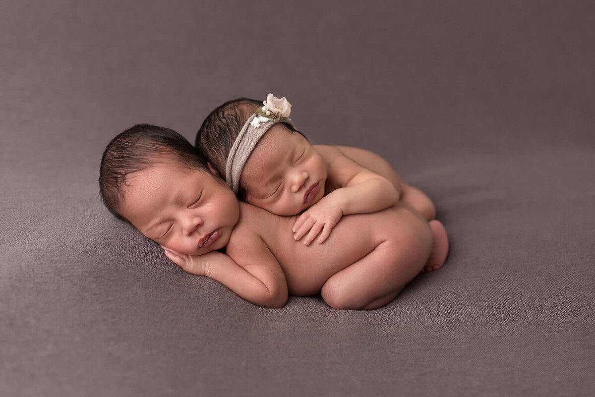 Newborn twin in grey background photo session in Houston