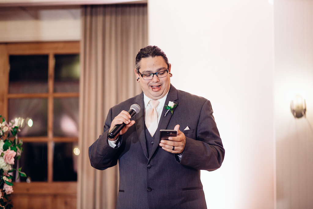 Wedding Photograph Of Man in Gray Suit Speaking Los Angeles