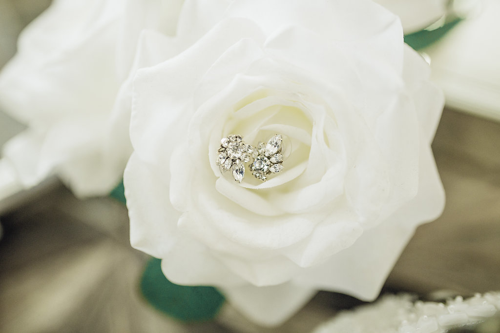 Wedding Photograph Of White Rose With Silver Earrings Los Angeles