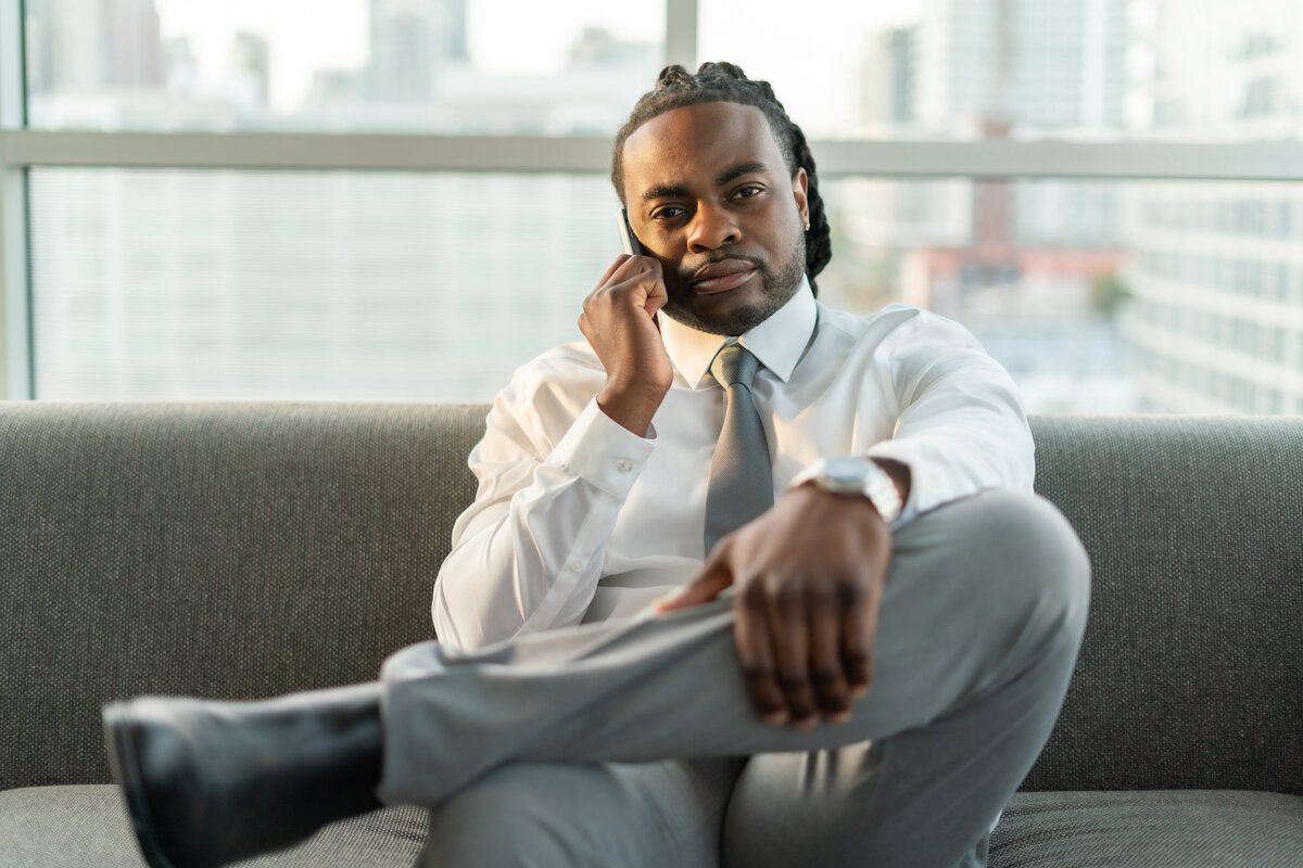 Black male real estate agent on the phone