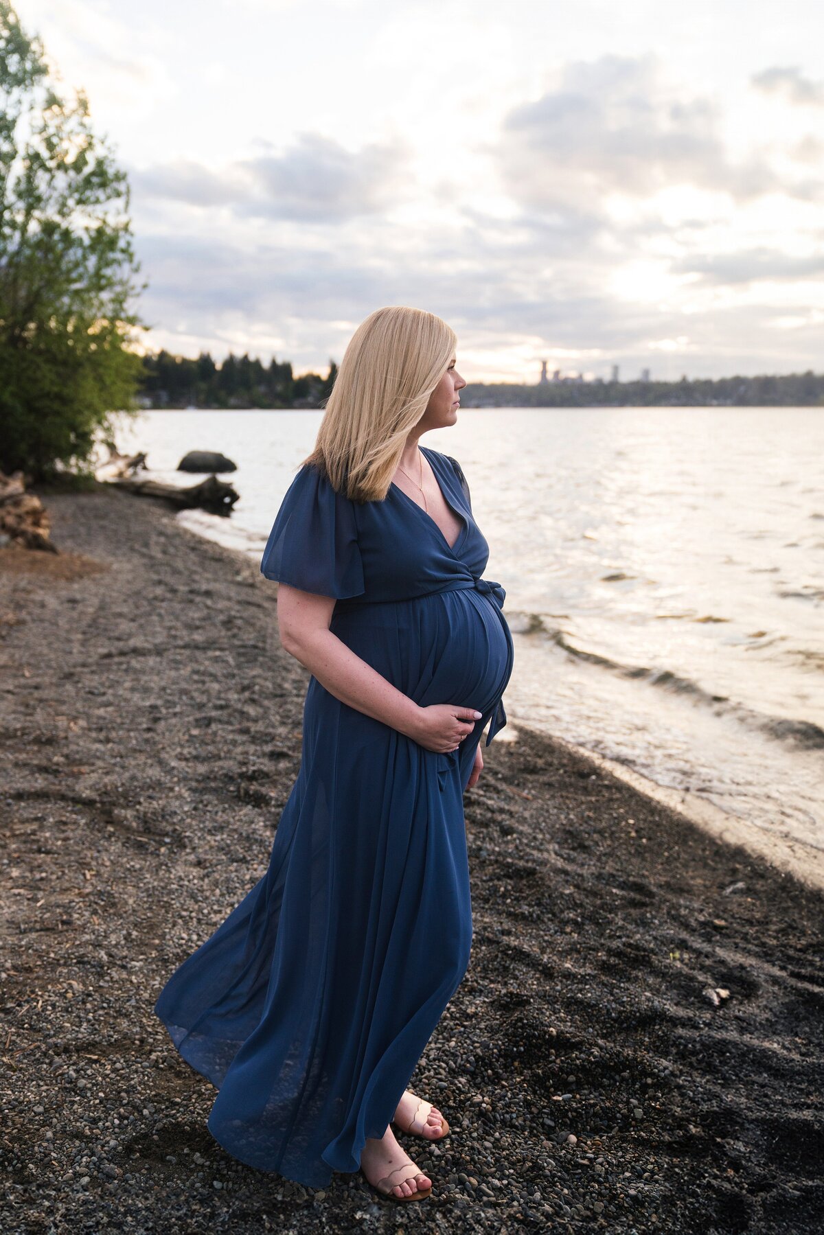 Mother in blue dress at sunset during Mercer Island Maternity photoshoot