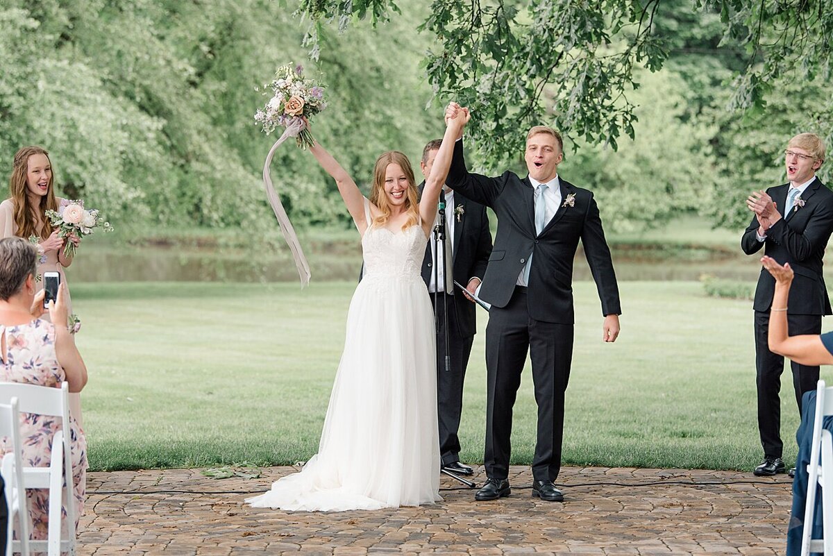 Bride and Groom celebrate after exchanging vows at outdoor wedding in Ohio