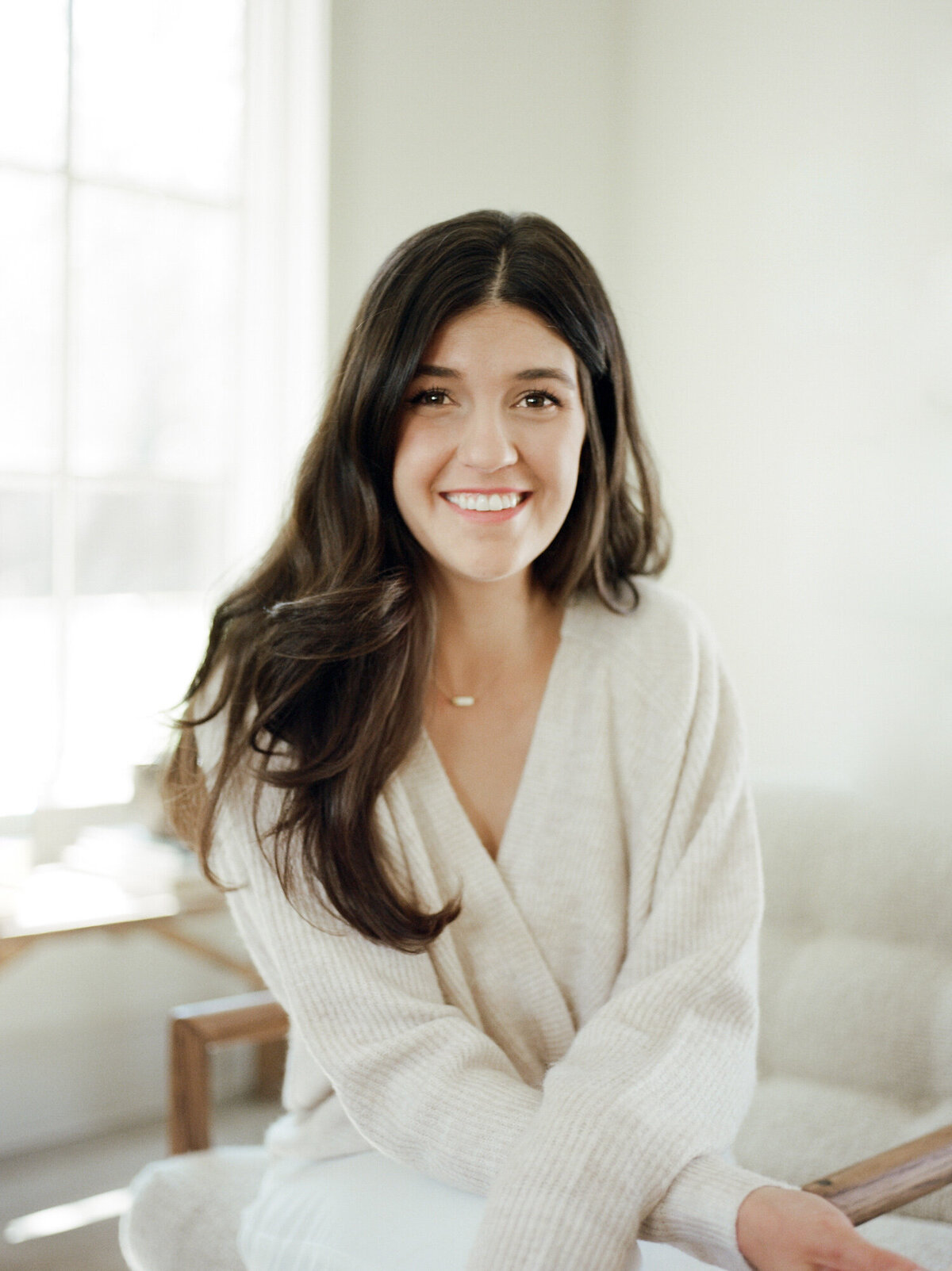 smiling designer at Fernhaus, Northern Michigan, film branding photoshoot for designer Lagom Creative