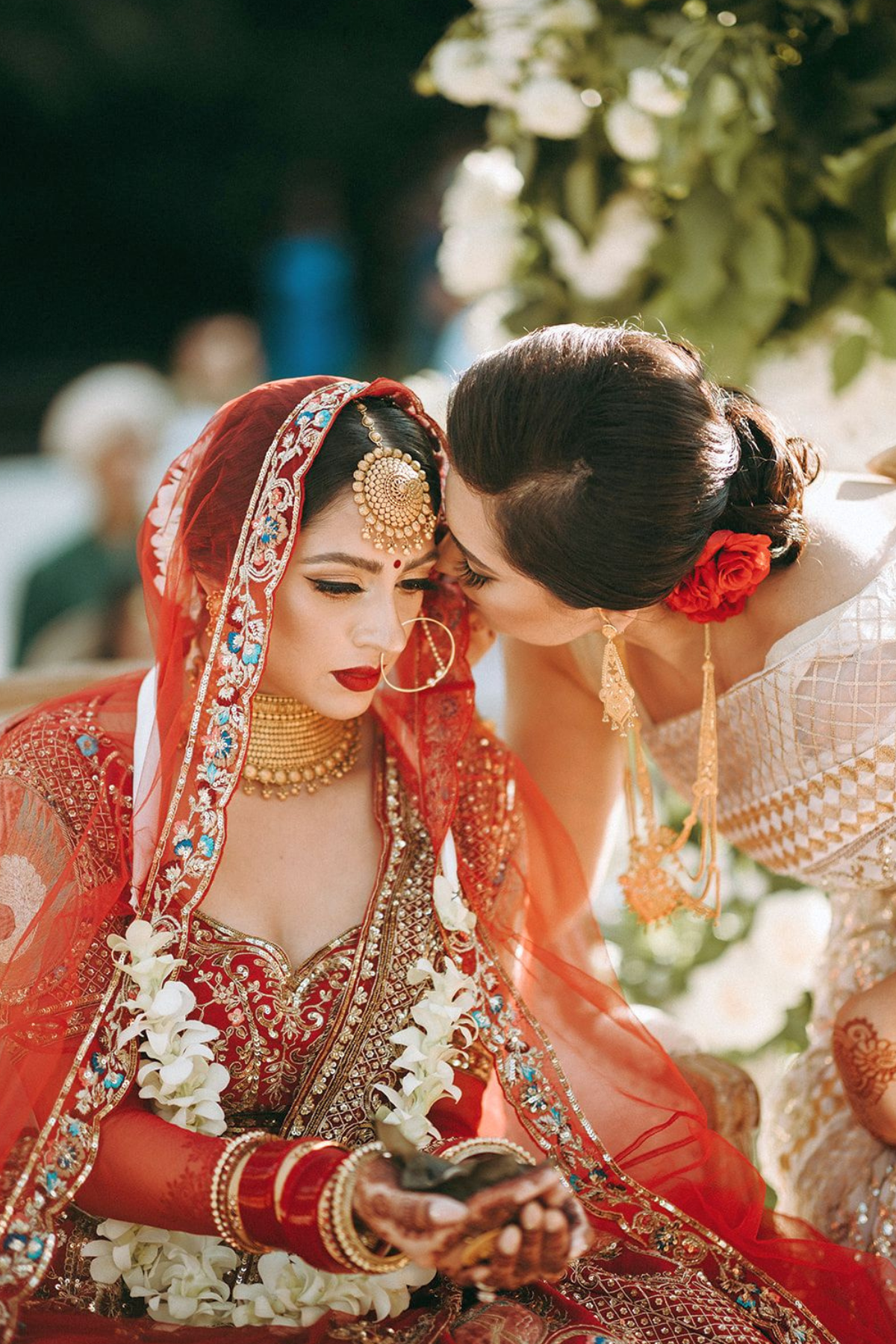 outdoor-garden-hindu-wedding-greenery-mandap-bride-red-lehenga-mom