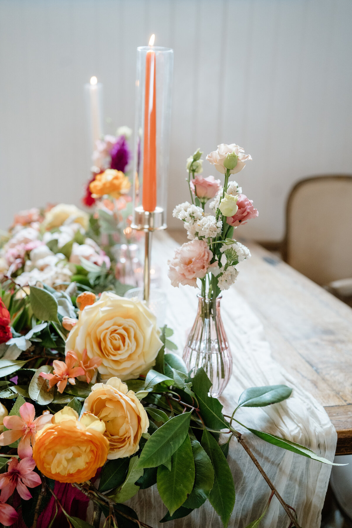 A bride outside with her bouquet at her summer wedding. Light and airy.