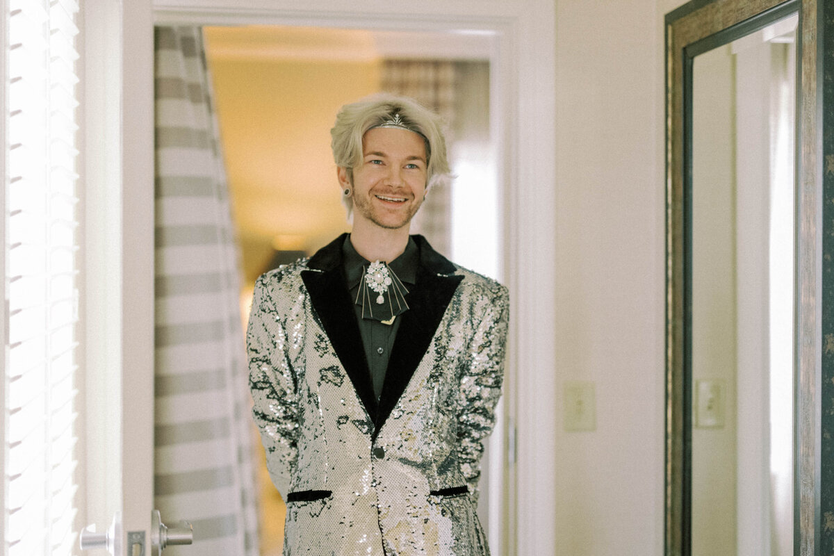groom-with-sequin-jacket-silver-headpiece