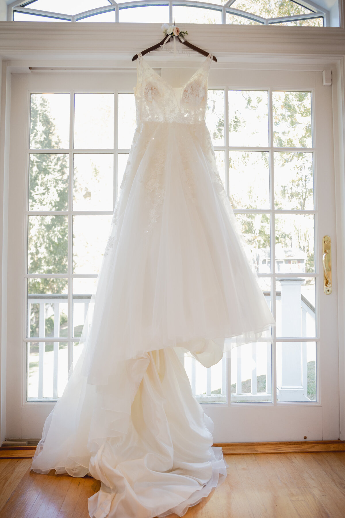 Photograph of a brides wedding dress on her wedding day.
