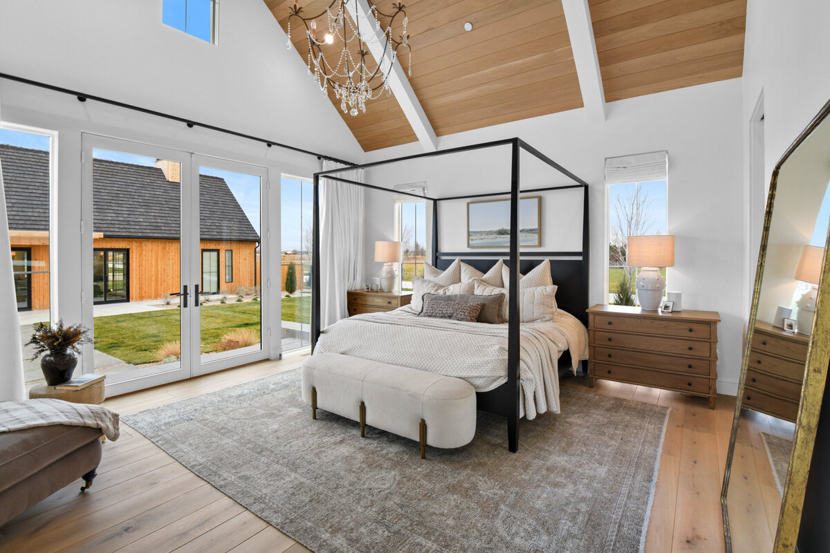Gorgeous master bedroom with vaulted ceilings by Idaho luxury custom home builder Thompson Homes