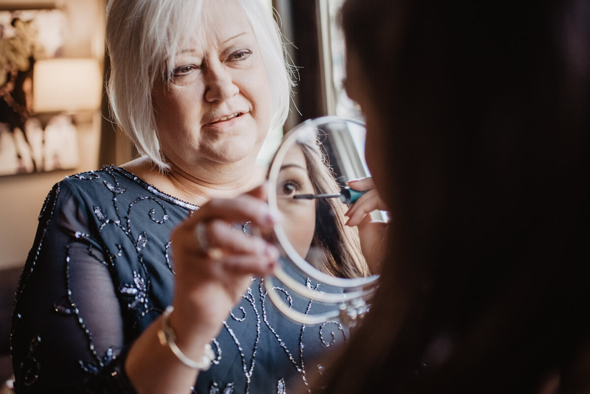 Photographers Jackson Hole capture woman holding mirror before Grand Teton wedding