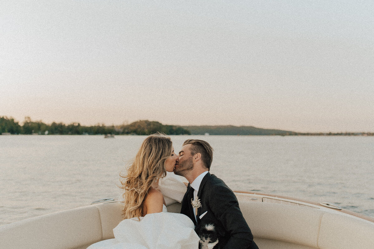 newlyweds kiss on boat
