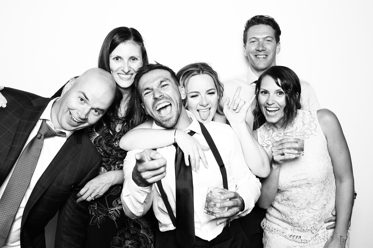 Wedding guests using Pure Portrait Photobooth & Phone Guest Book, timeless and fun wedding rentals based in Calgary, AB. Featured on the Brontë Bride Vendor Guide.