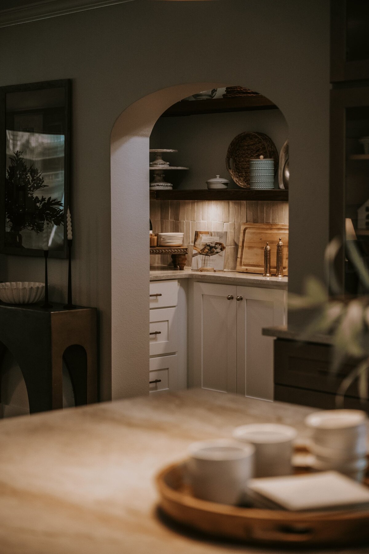 dewine design orlando interior design vintage cove trail kitchen arched doorway with under cabinet lighting