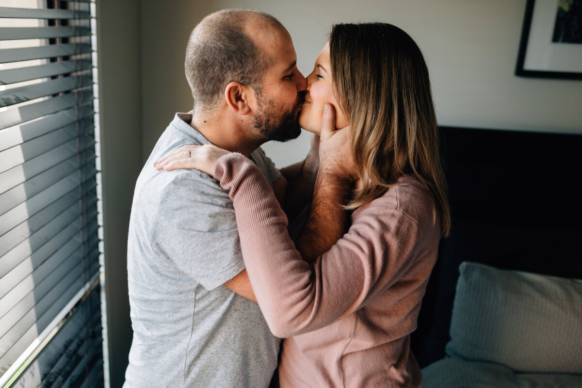 Man and woman kissing and hugging standing inside. Couples photography Melbourne, And So I Don’t Forget Photography