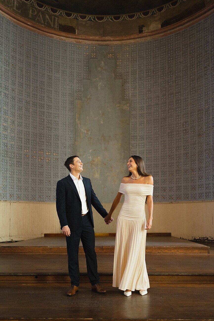girl and guy holding hands at hotel peter and paul in new orleans