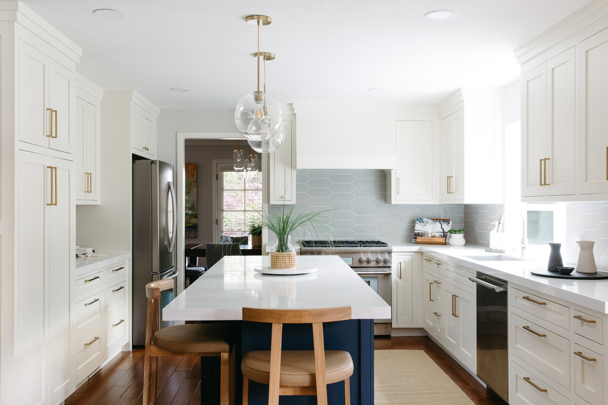 white and gold kitchen remodel with a pop of color