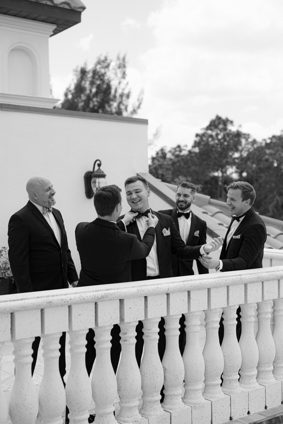 Groomsmen preparing for ceremony at La Casa Toscana wedding venue