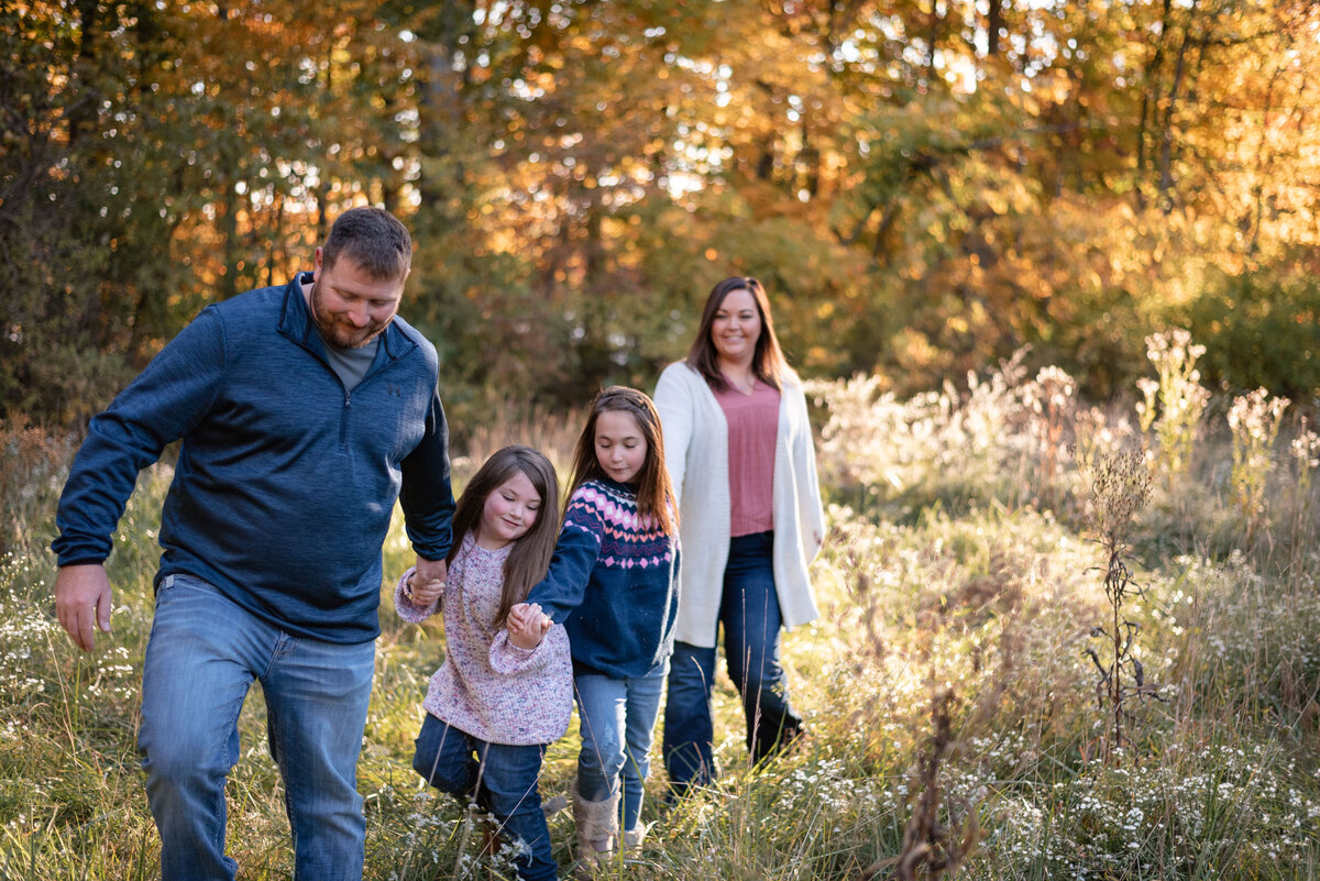 family walking together holding hands in bluffton family photographer northeast indiana