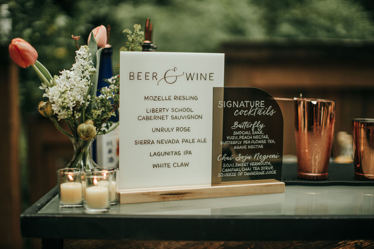 Bar and signature drinks sign for a forest wedding