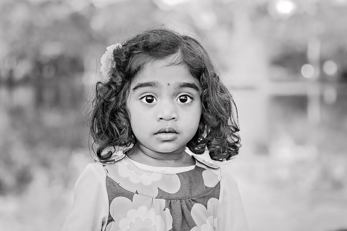 NJ Child Portrait-Black and white photo of Toddler girl in downtown Westfield, NJ