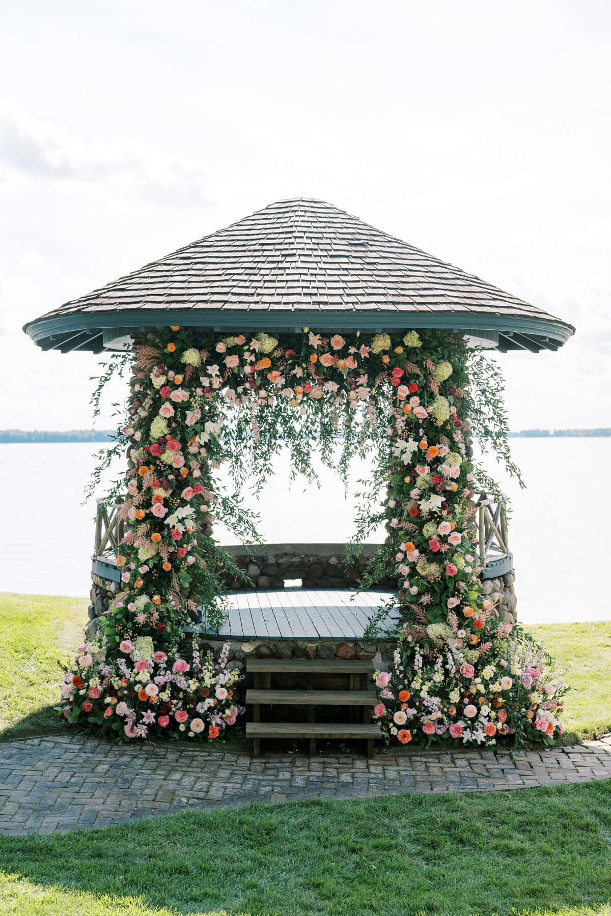 Floral arch on gazebo on lake minnetonka