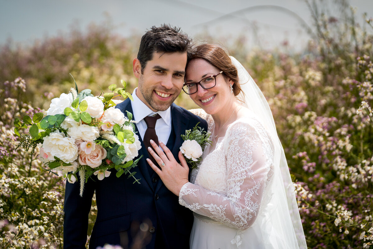 Elegant portraits of a newlywed couple captured near the picturesque Battery Point Lighthouse, highlighting the beauty of the Northern California coast.