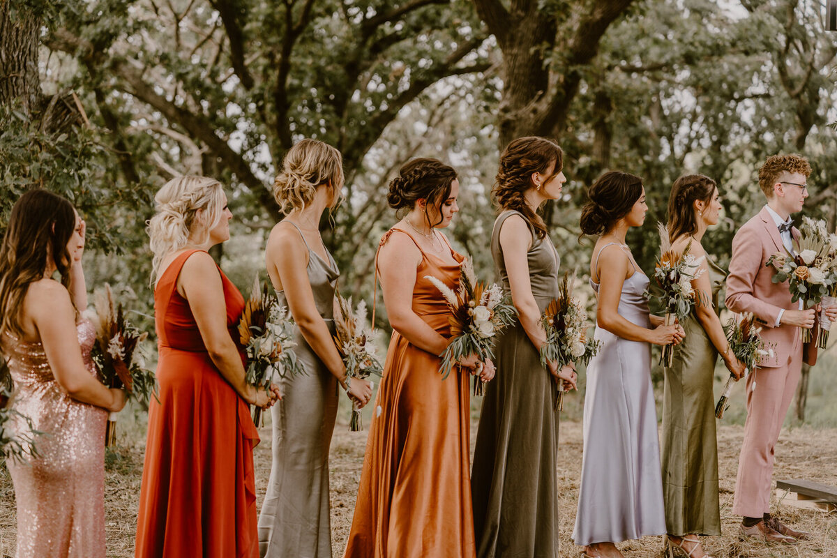 wedding-ceremony-bridesmaids-iowa-des-moines-wedding-photographer-storyteller-collective-photo-co