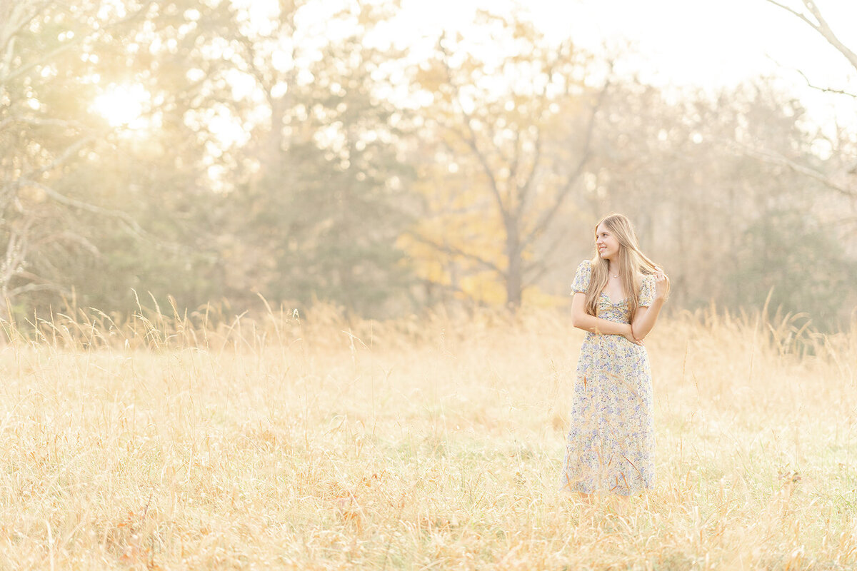 girl playing with hair during Bristow, VA senior photo