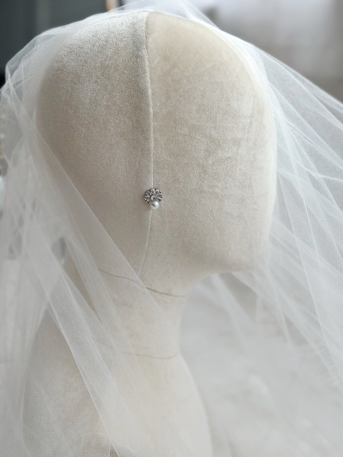 Classic pearl earrings paired with delicate crystal embellishments
