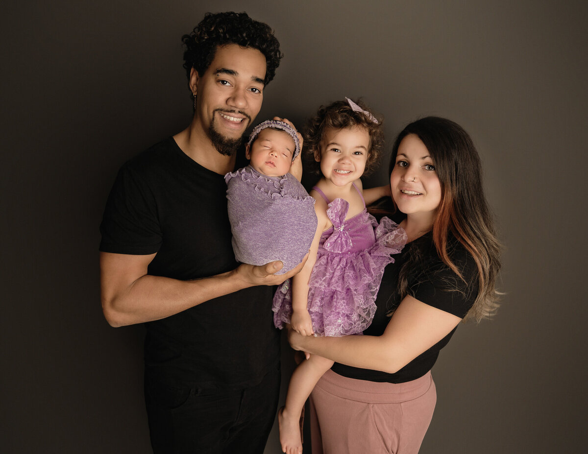 Mom and dad with their daughter and newborn Toronto, ON photo session, by Tamara Danielle Photography.