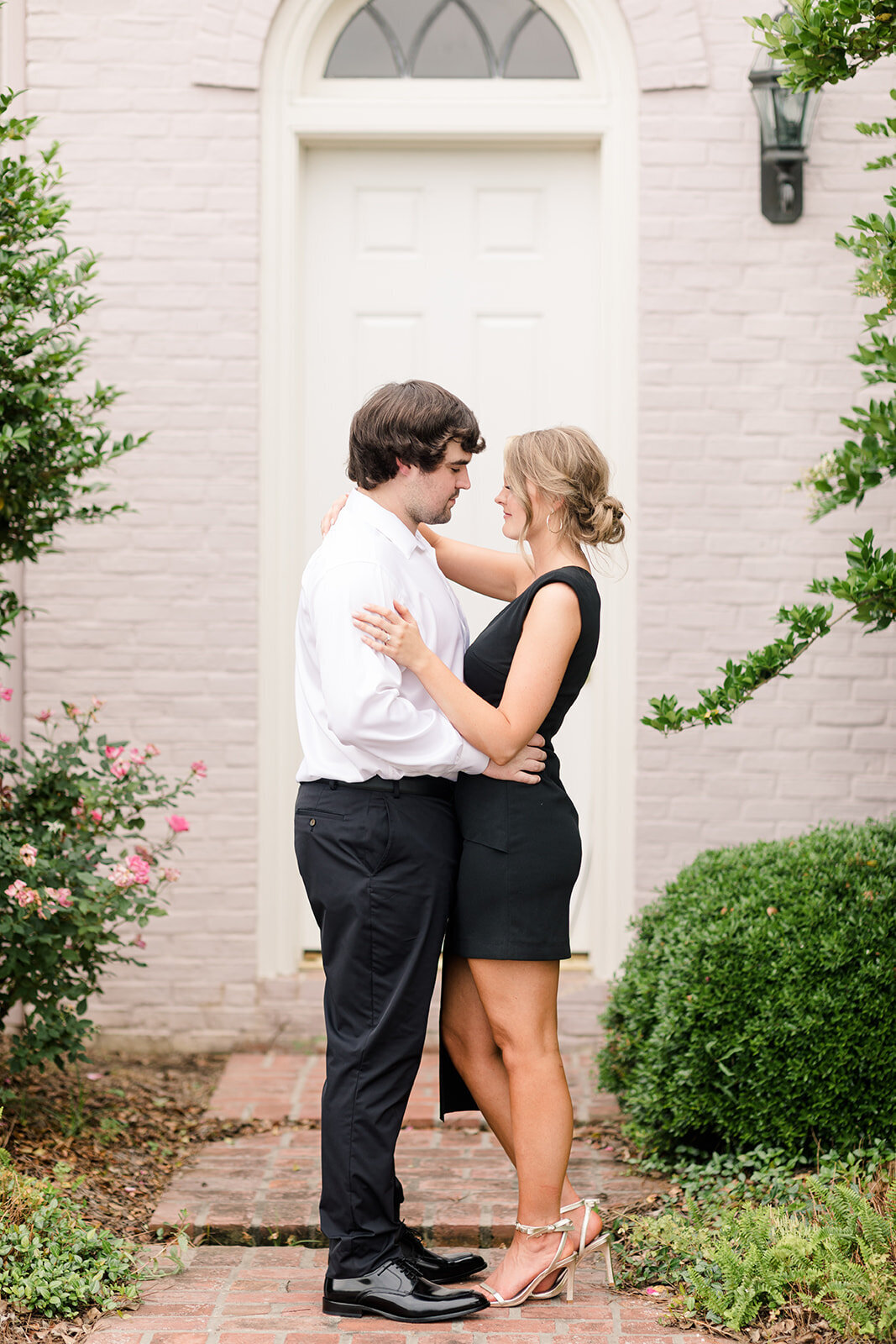 Engagement photo of couple in front of door at The Mansion at Red Hill in Delhi, Louisiana