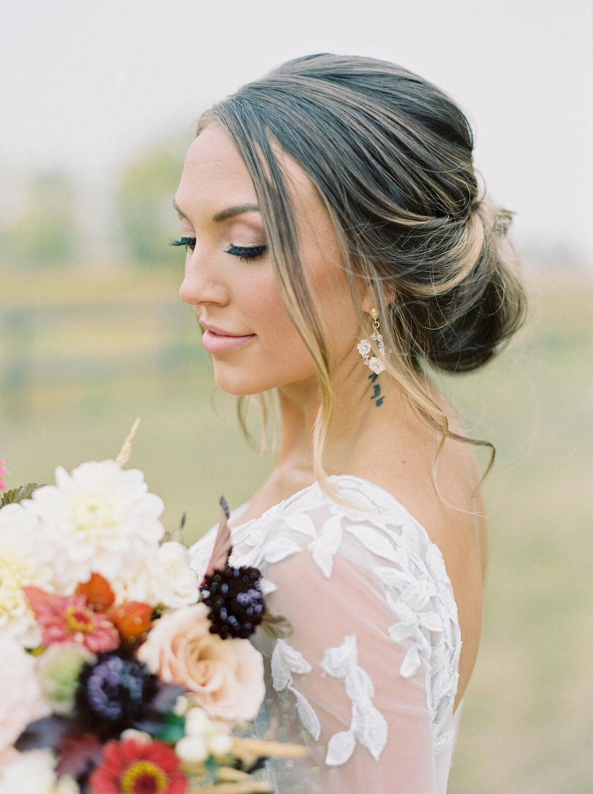 Classic and romantic bridal up-do by Madi Leigh Artistry, experienced and inclusive Calgary hair & makeup artist, featured on the Brontë Bride Vendor Guide.
