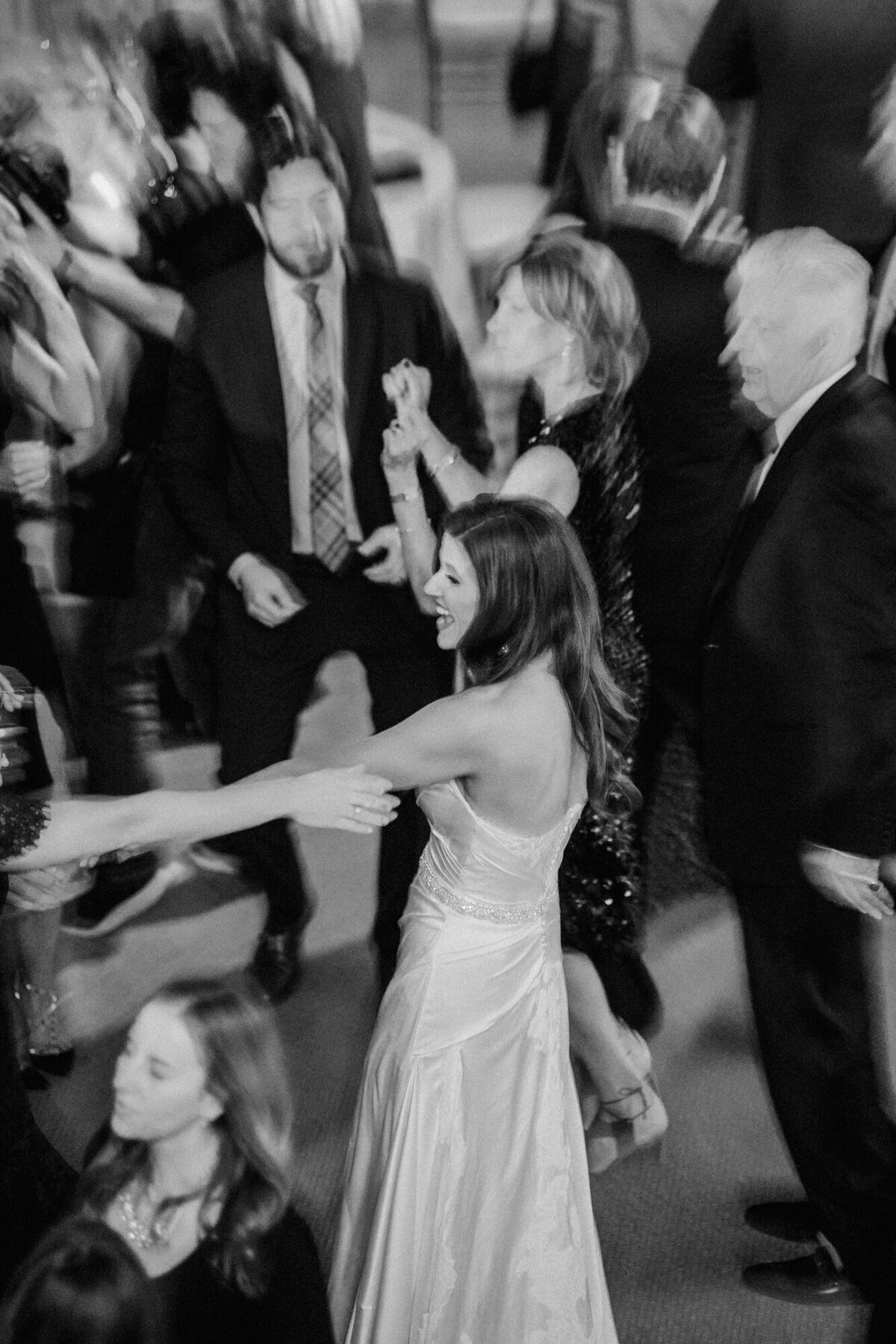 A candid moment on the dance floor of a wedding in Chicago