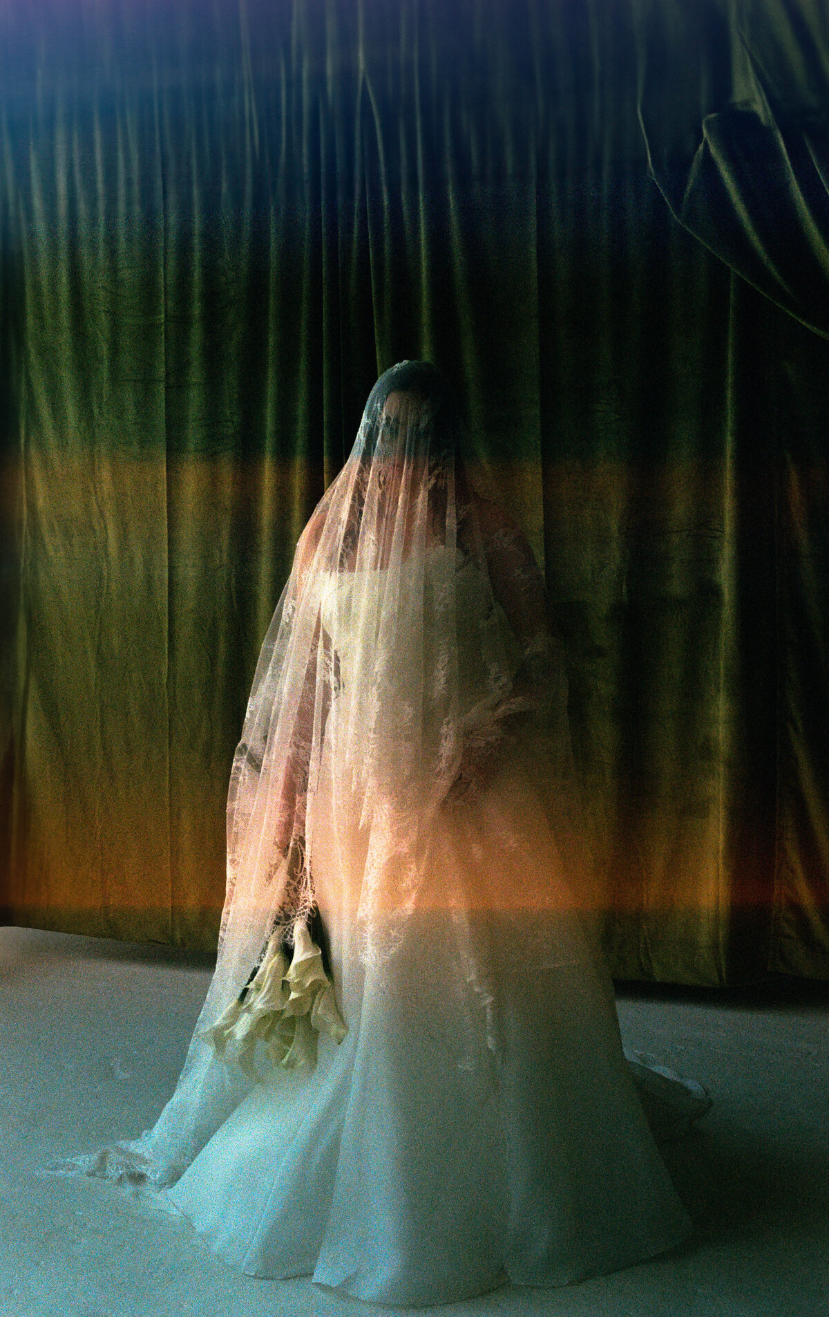 35mm film light leak bridal portrait green velvet backdrop ethereal cala lillies