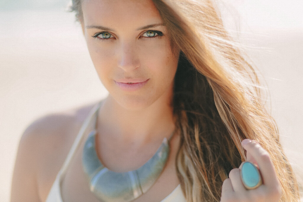 close up of beautiful girl with turquoise jewelry