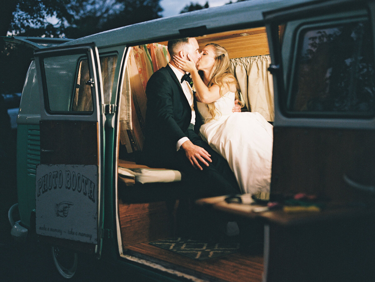 bride and groom in the back of a camper van at Tented wedding in Cape Cod, Massachusetts