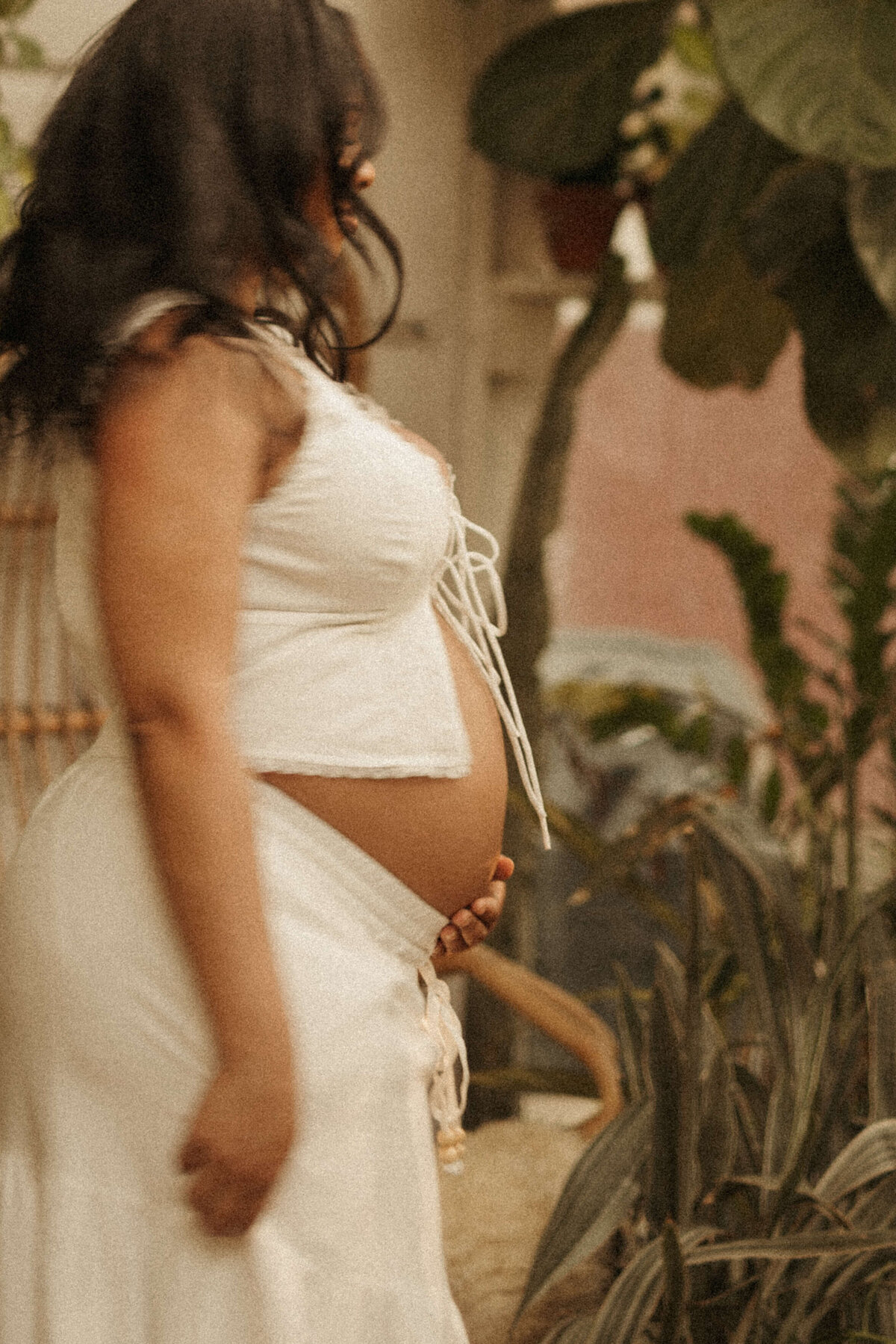 Expecting mother in long flowing dress during Franklin TN outdoor photo session