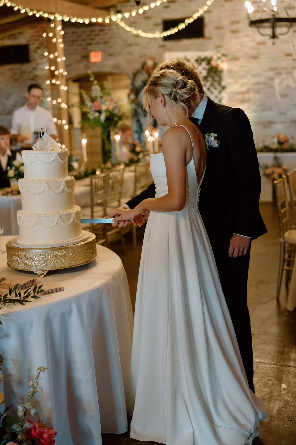 Bride and groom cut their cake