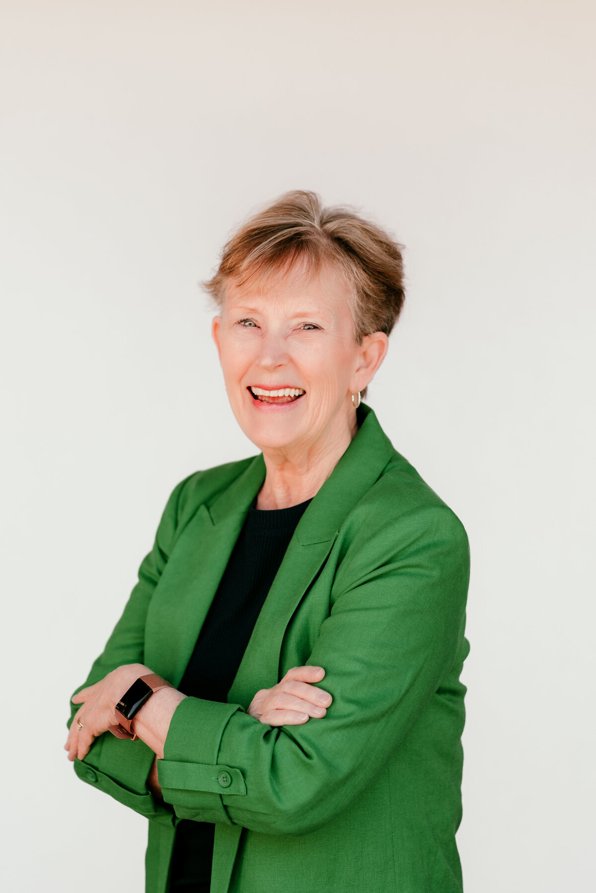 Headshot of a small business owner with a relaxed expression, styled for branding and website use.