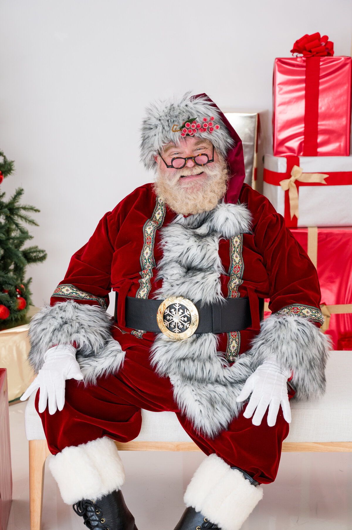 Santa Claus with milk and cookies setup during festive branding mini session by Lissette G in Houston