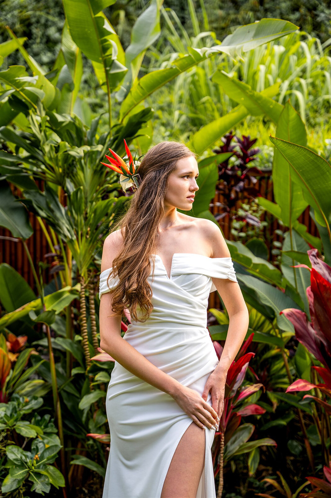 Bride posing in greenery for wedding photographers on the big island of hawaii
